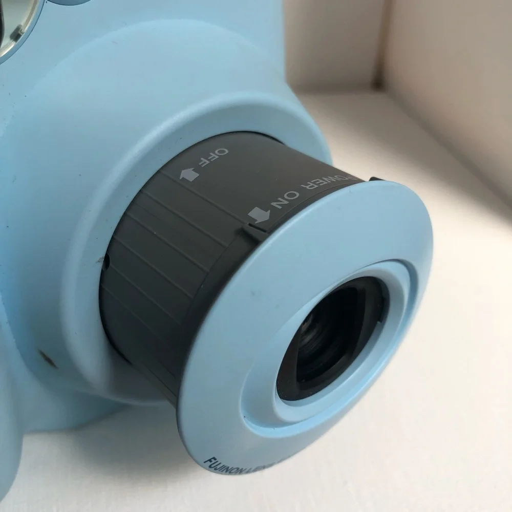 Blue instax mini 7s Polaroid camera